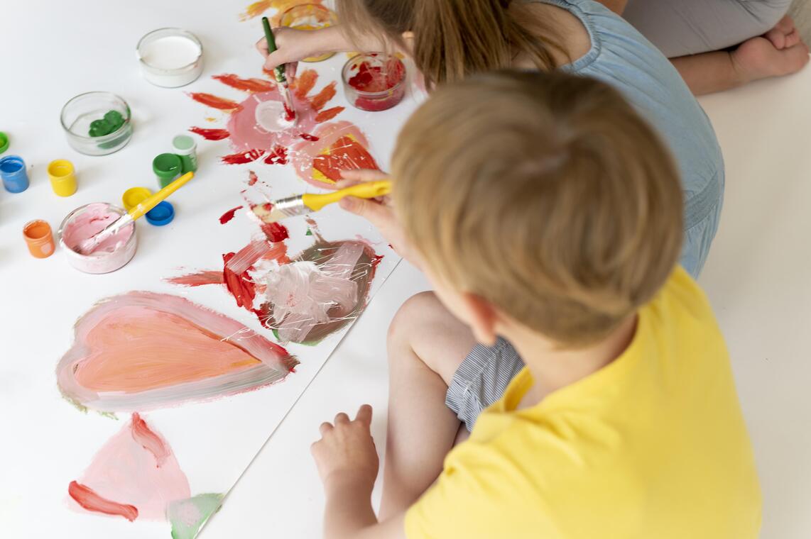 close-up-boy-girl-painting-together.jpg