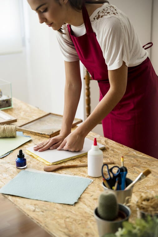 young-woman-pressing-paper-pulp-mold.jpg