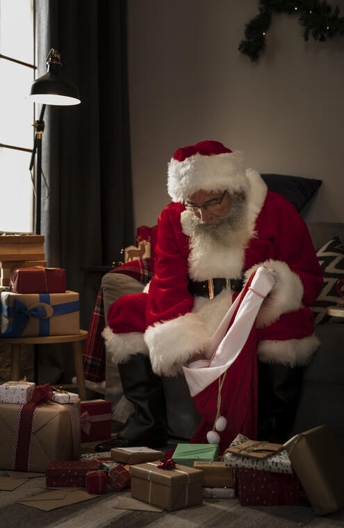 santa-claus-preparing-his-bag-gifts