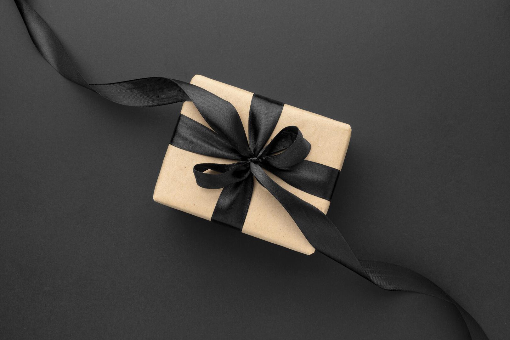flat-lay-black-friday-sales-assortment-with-gifts