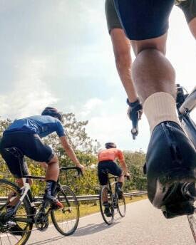point of view male chinese cyclist competing in sports race cycling event at rural scene