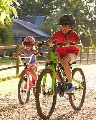 Two Children On Cycle Ride Together