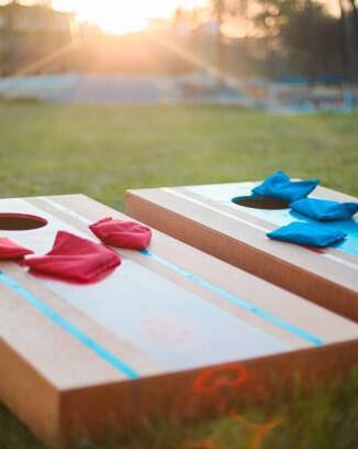 Homemade corn hole board game in backyard