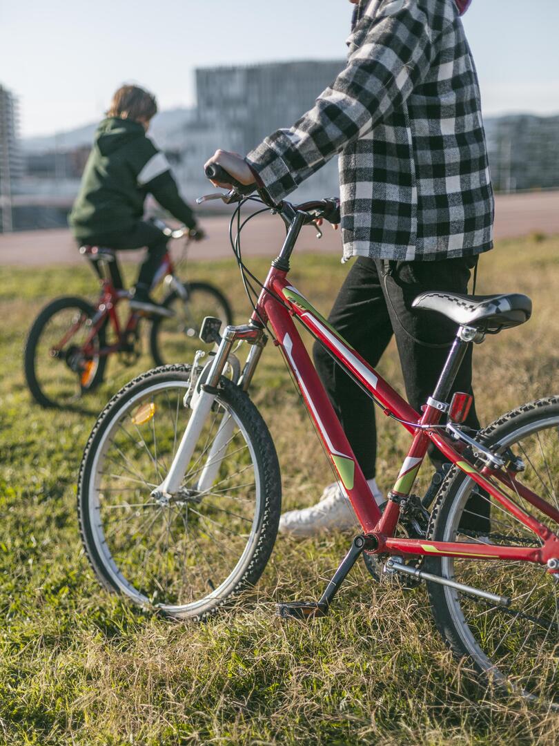 two-boys-grass-with-their-bikes