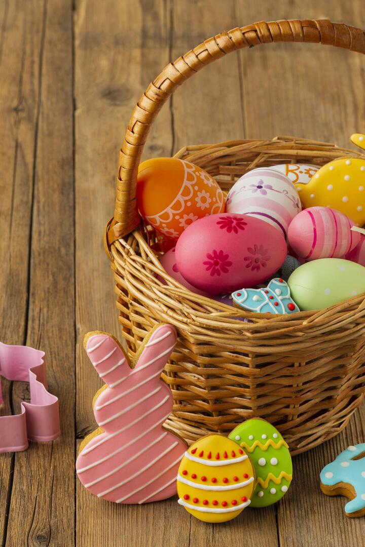 high-angle-colorful-easter-eggs-basket-with-bunny