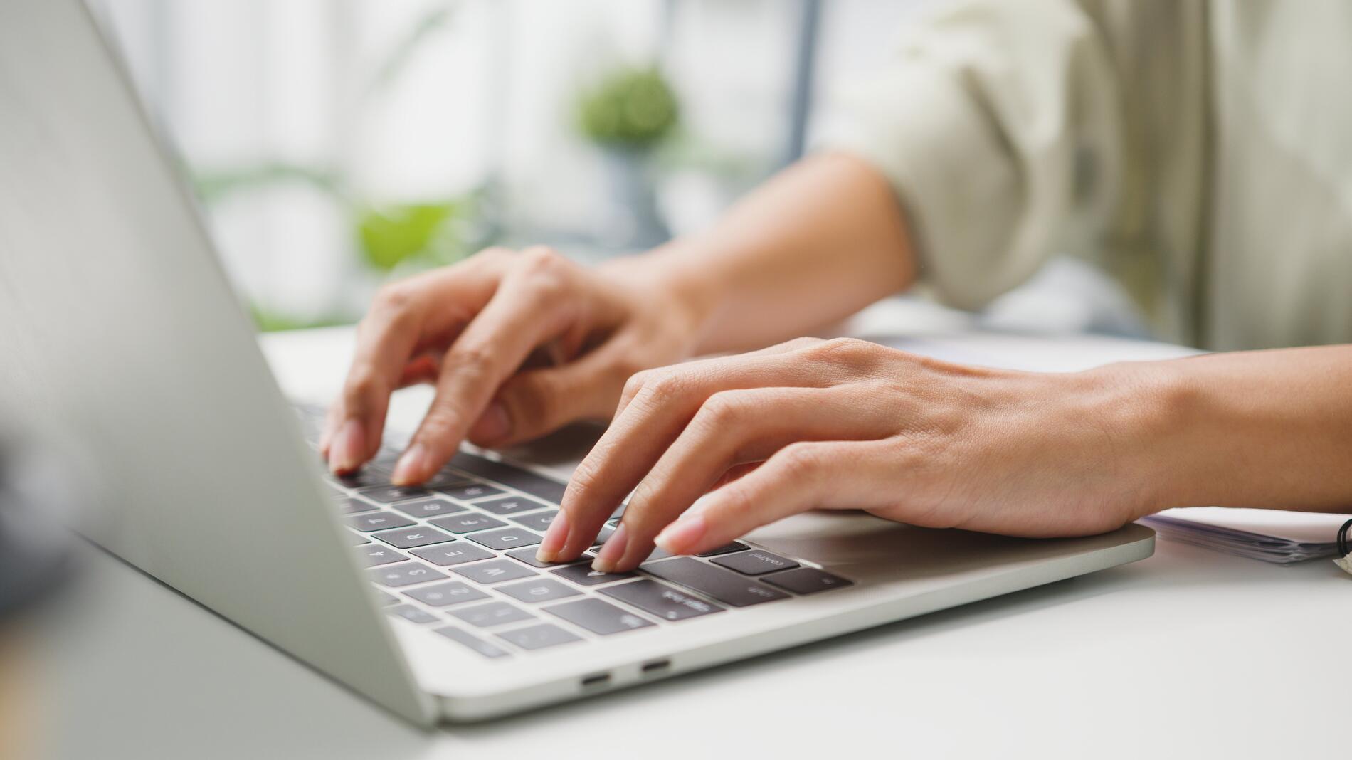 Freelance young Asia businesswoman casual wear using laptop working in living room at home. Working from home, remotely work, self isolation, social distancing, quarantine for corona virus prevention.