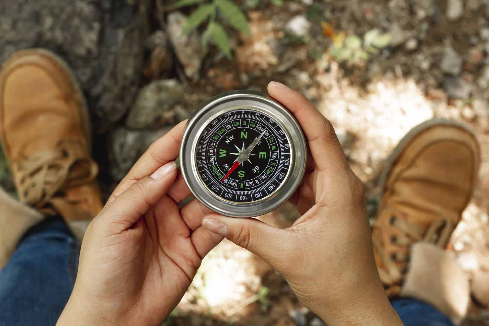 top-view-woman-holding-compass_1