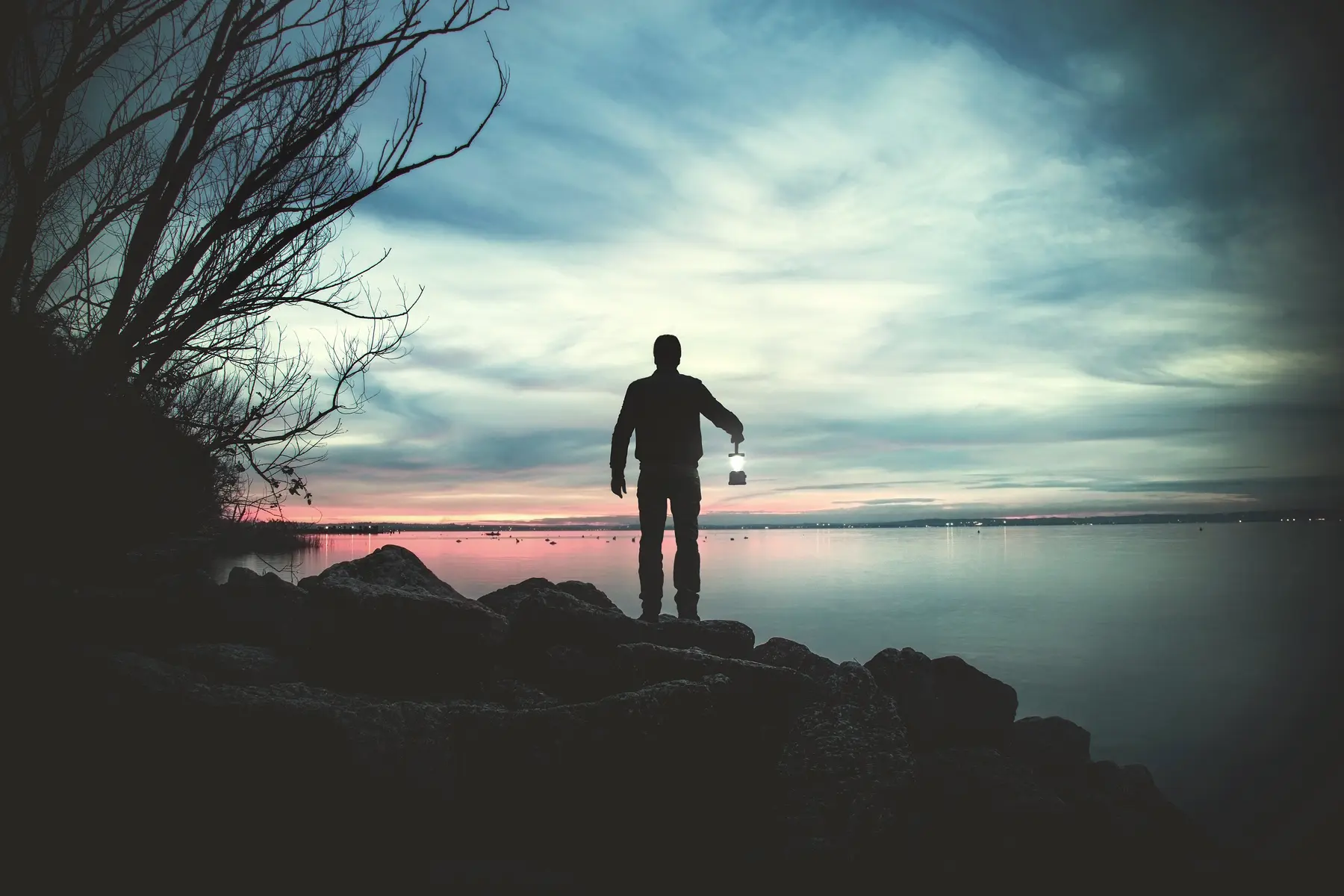 Man walking in the dark with a torch