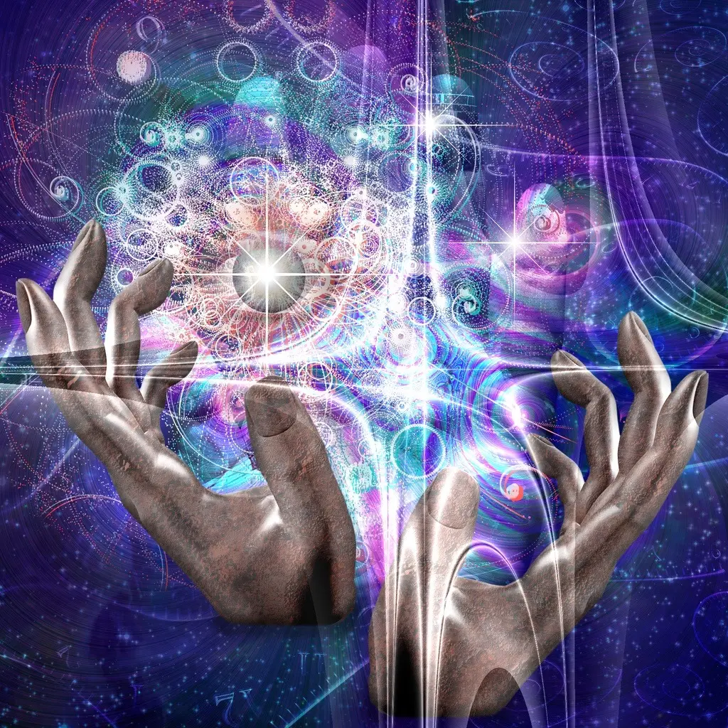 Les mains manipulent les propriétés de l’univers.