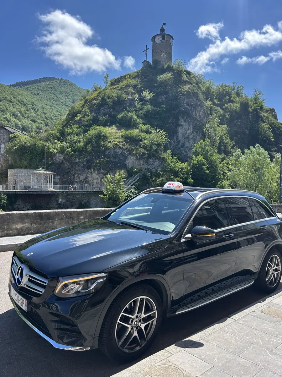 Cab -T vehicle with the Castella tower in the background