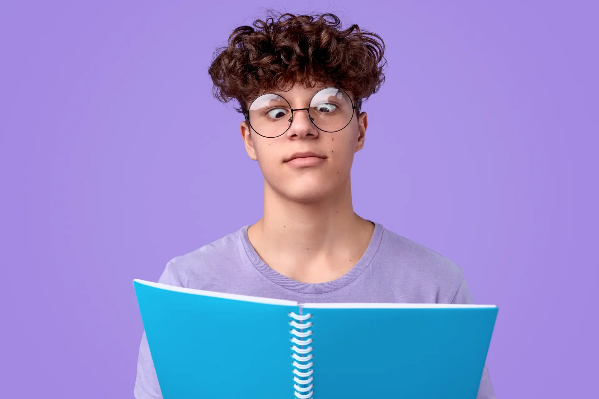 Funny teenager reading notebook
