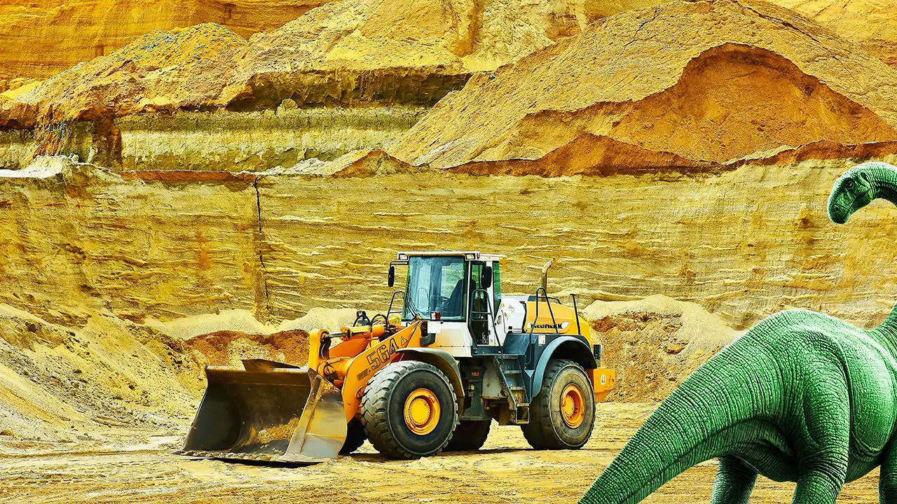 tractopelle dans une carrière et dinosaure