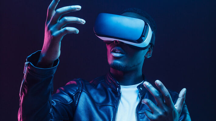 African man wearing virtual reality headset