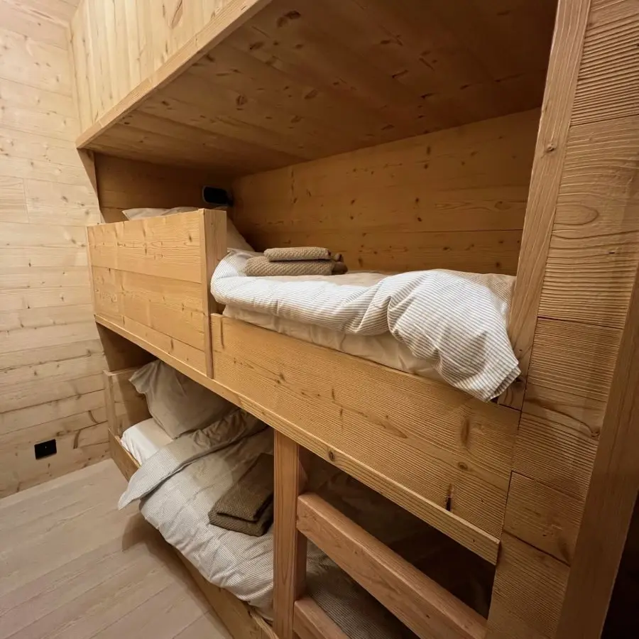 Children's bedroom with bunk beds, wooden interior