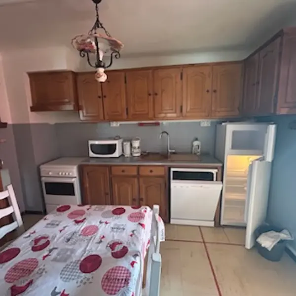 Bright kitchen, fully equiped. Wooden furniture