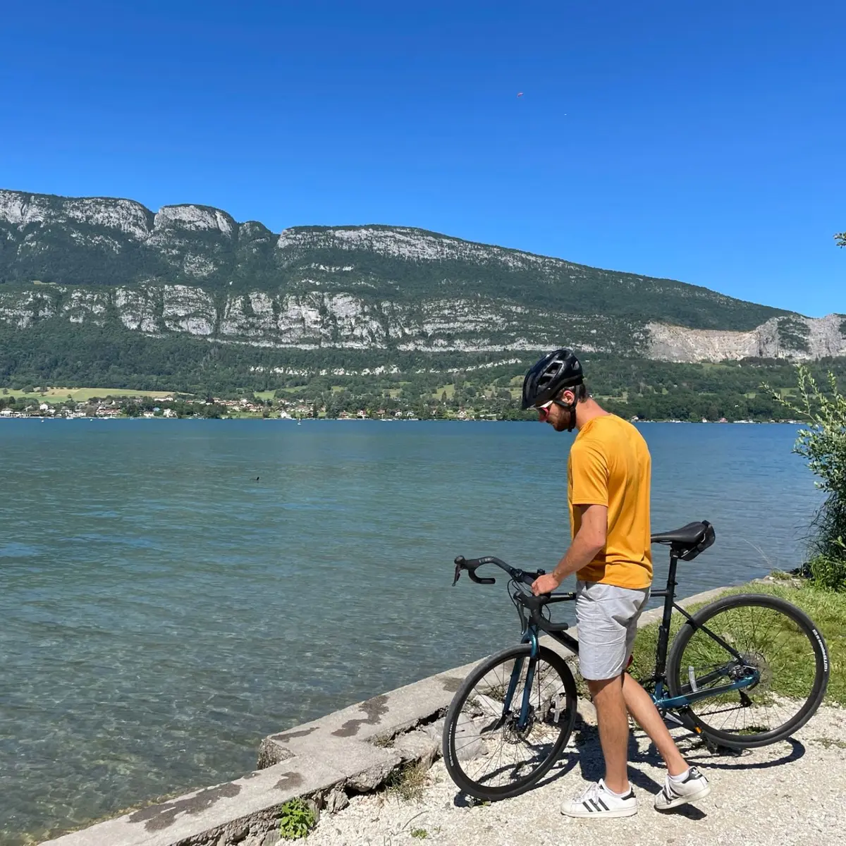 cyclist by lake Annecy