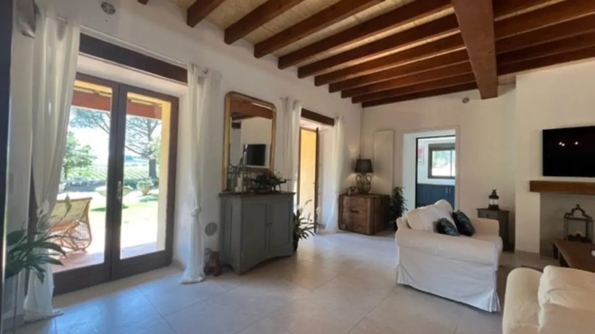 Spacious lounge with doors opening up to front south facing garden.