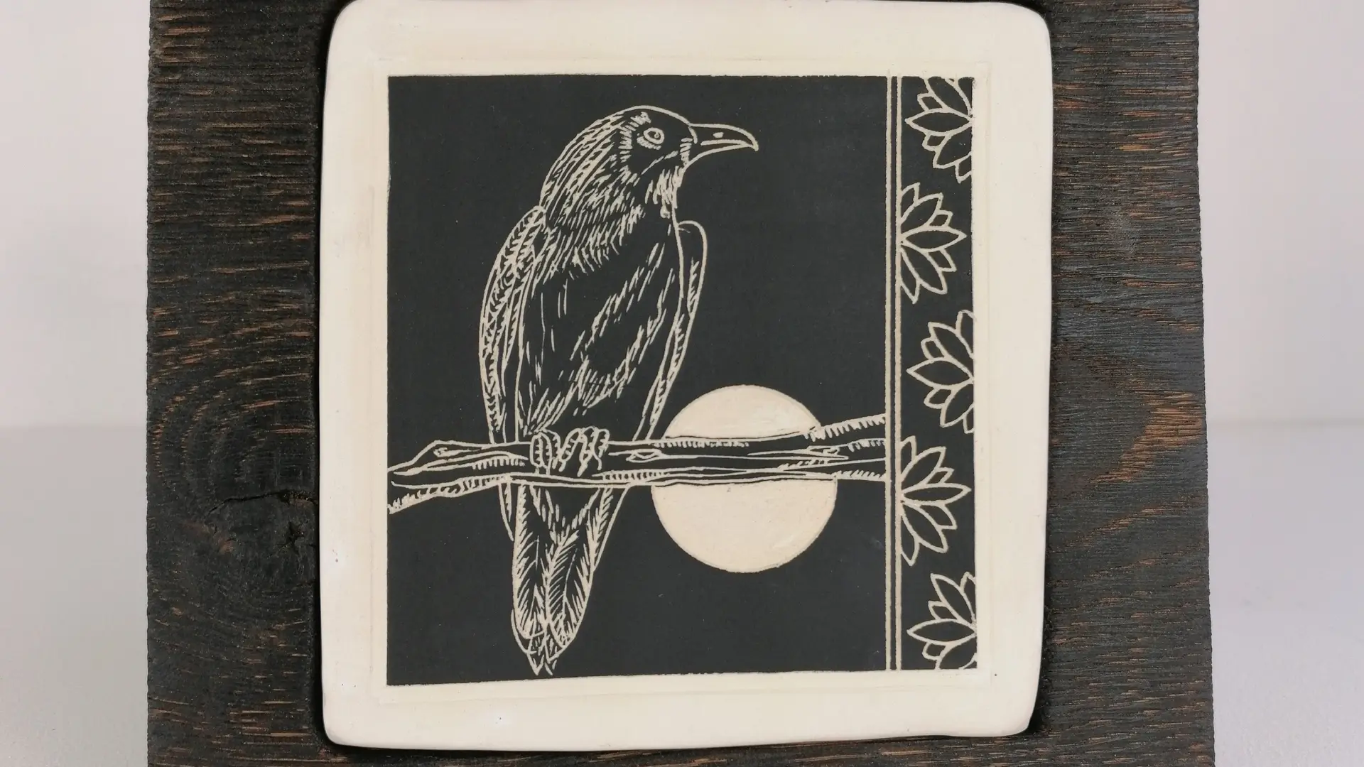Crow 1_WhiteearthenwareSgraffitoOakframe_18cmHigh21cmWide2cmdeep_SmartMichaella_150GBP