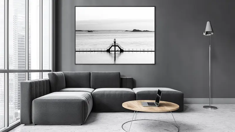 Mockup canvas in dark living room with black sofa on marble floor