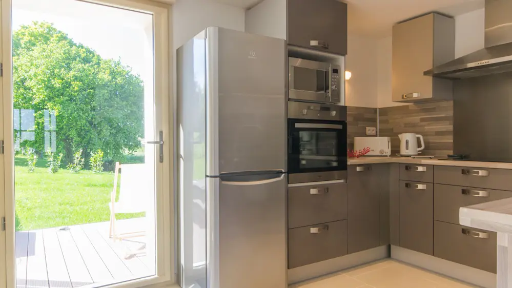 Cuisine équipée accés terrasse Barbecue