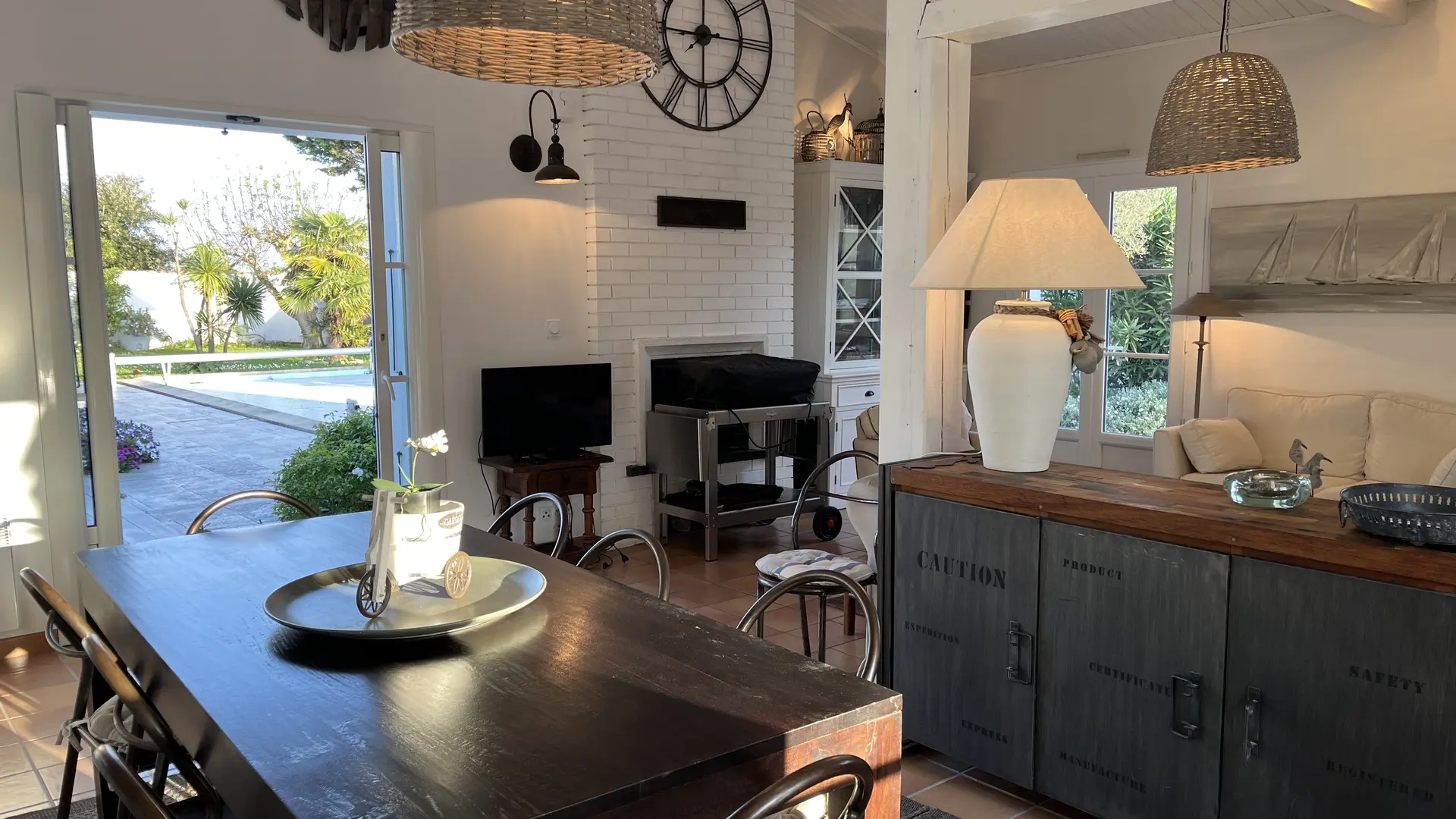 Living room + dining table + access to outdoor area & swimming pool