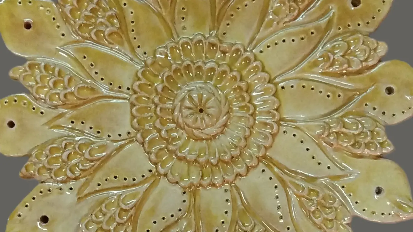 Création soleil en poterie