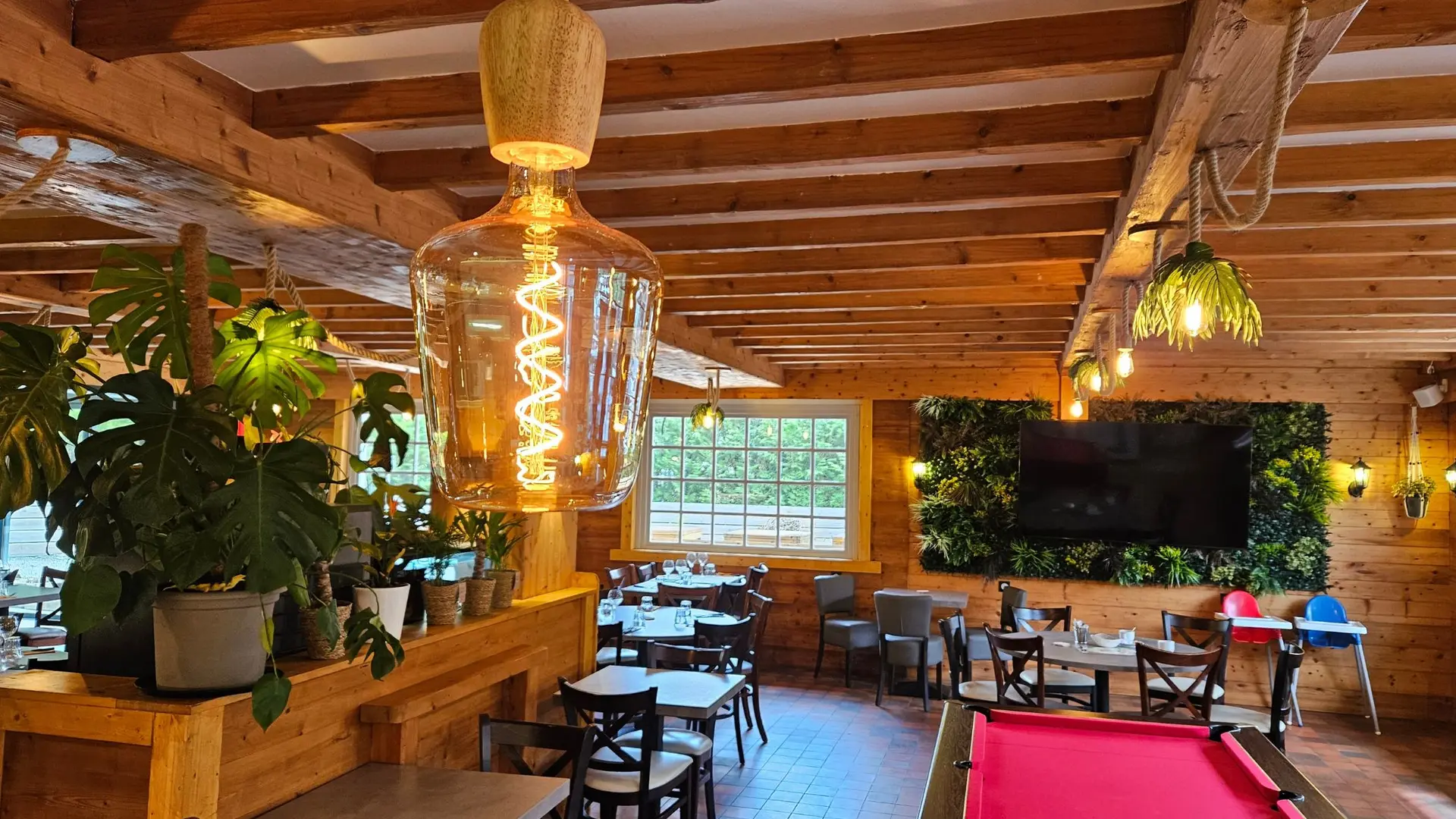 dining room with vegetal wall and pool table