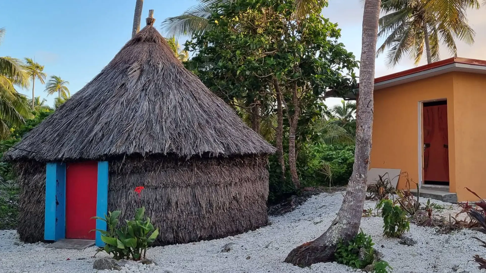 Traditional hut and toilet and shower block