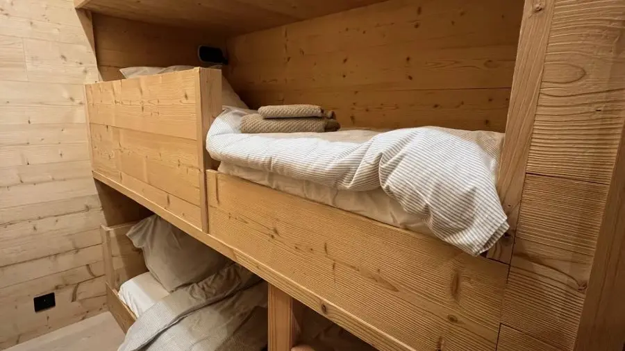 Children's bedroom with bunk beds, wooden interior
