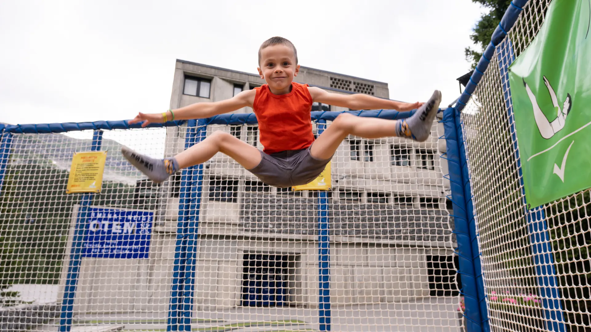Boy doing the splits while jumping