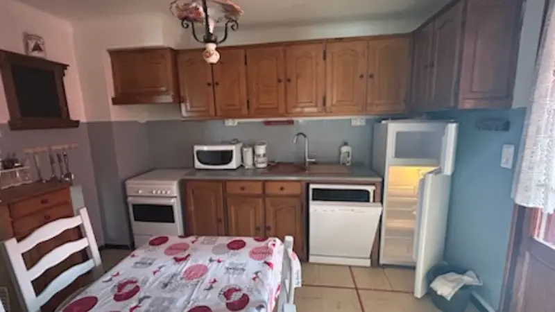 Bright kitchen, fully equiped. Wooden furniture
