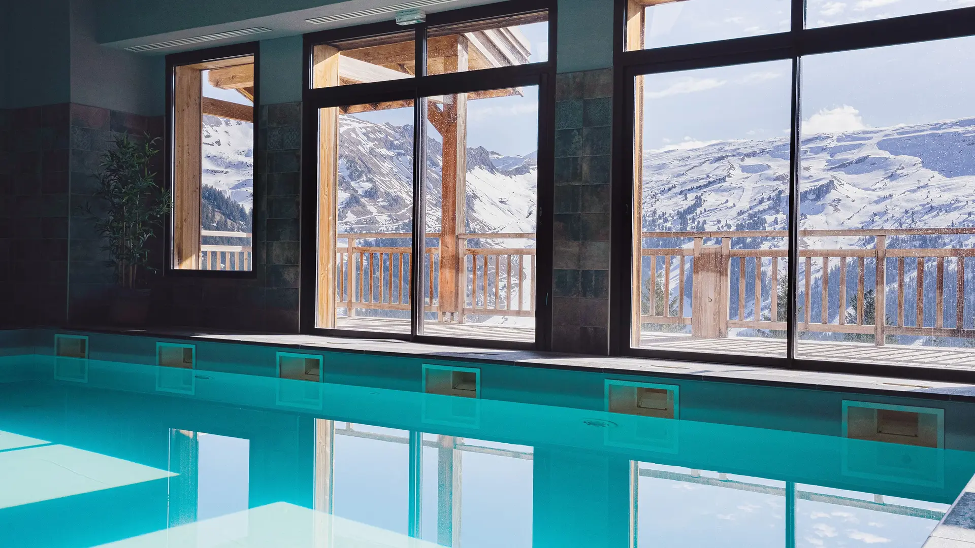 The indoor swimming pool with views of the ski area