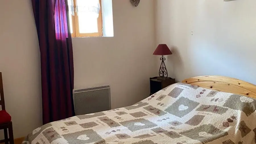 Bright bedroom with double bed, window