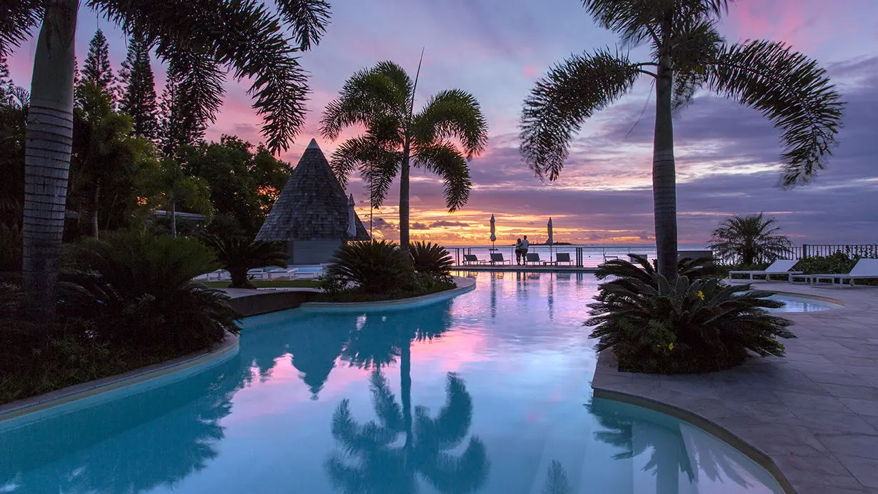 Piscine au coucher de soleil - Château Royal