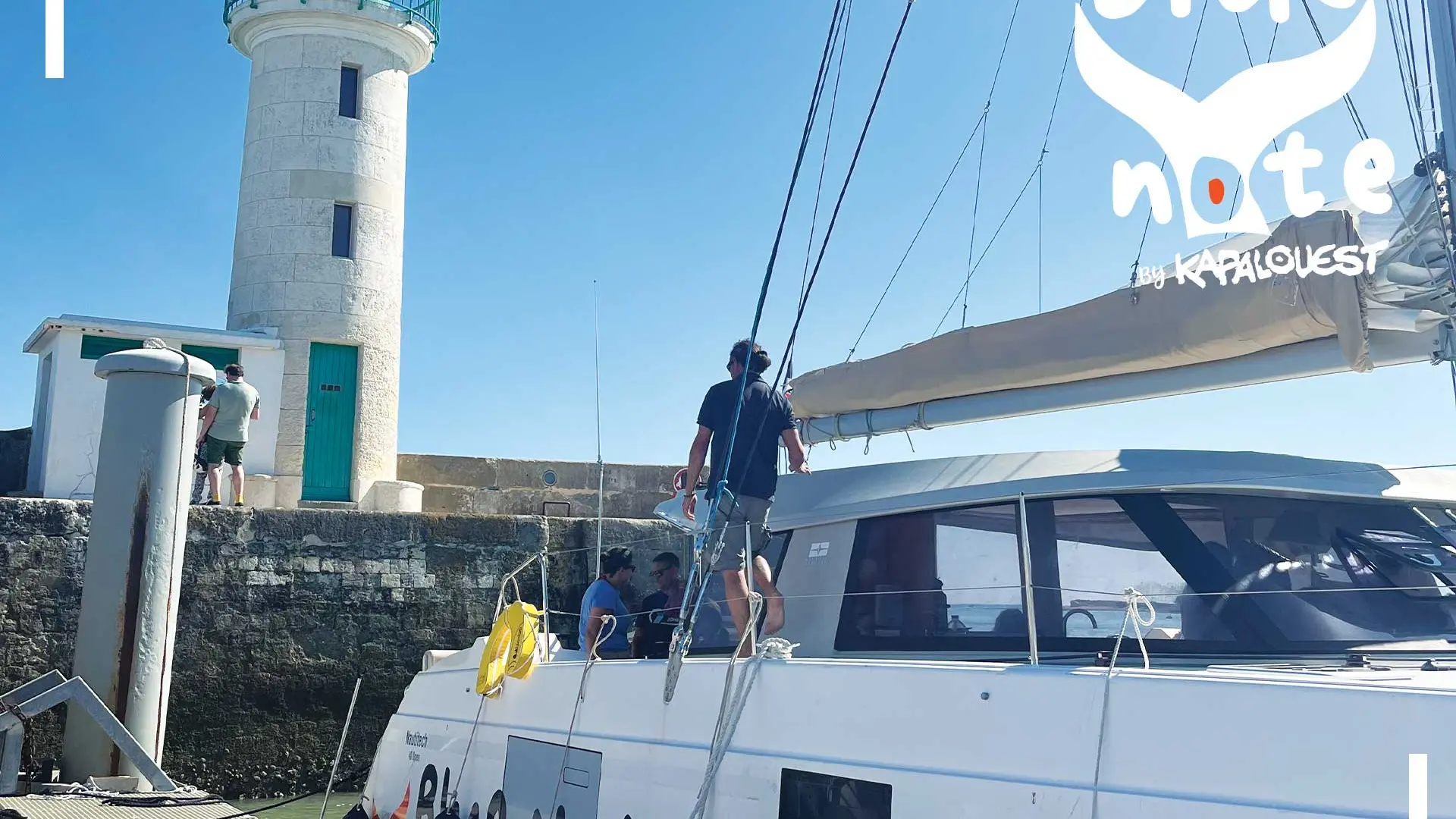 Blue Note sailing catamaran docked by Kapalouest