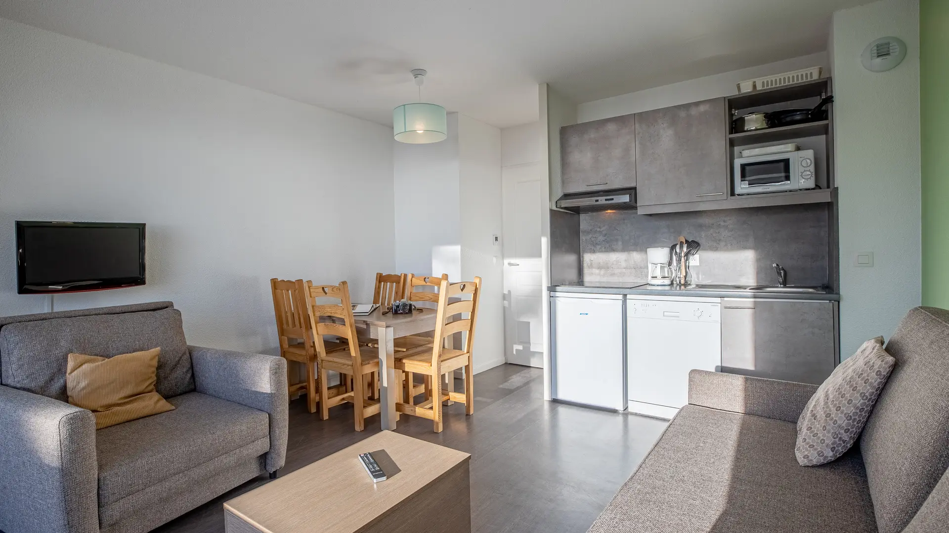 Living room with view of dining room and kitchen