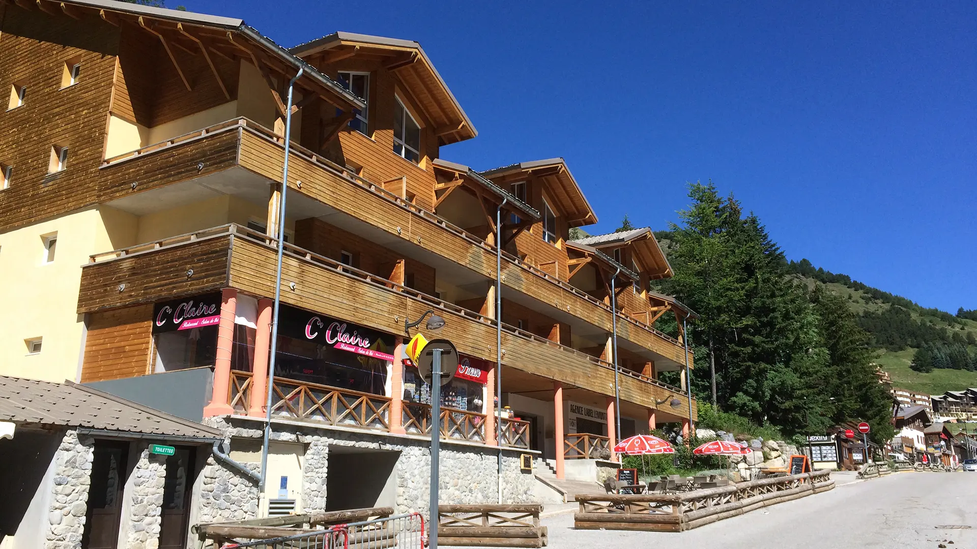 Exterior view of the multi-story residence in La Foux, with terraces