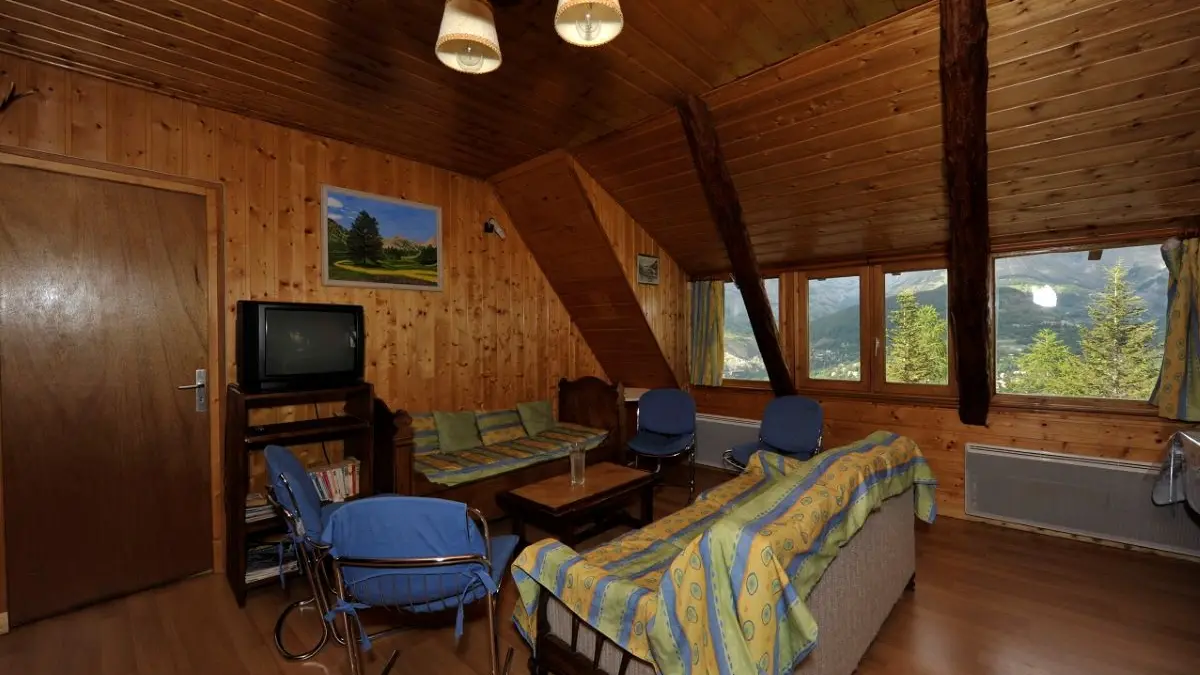 Fully equipped apartment living room, sofa, coffee table, TV, wooden furniture, window