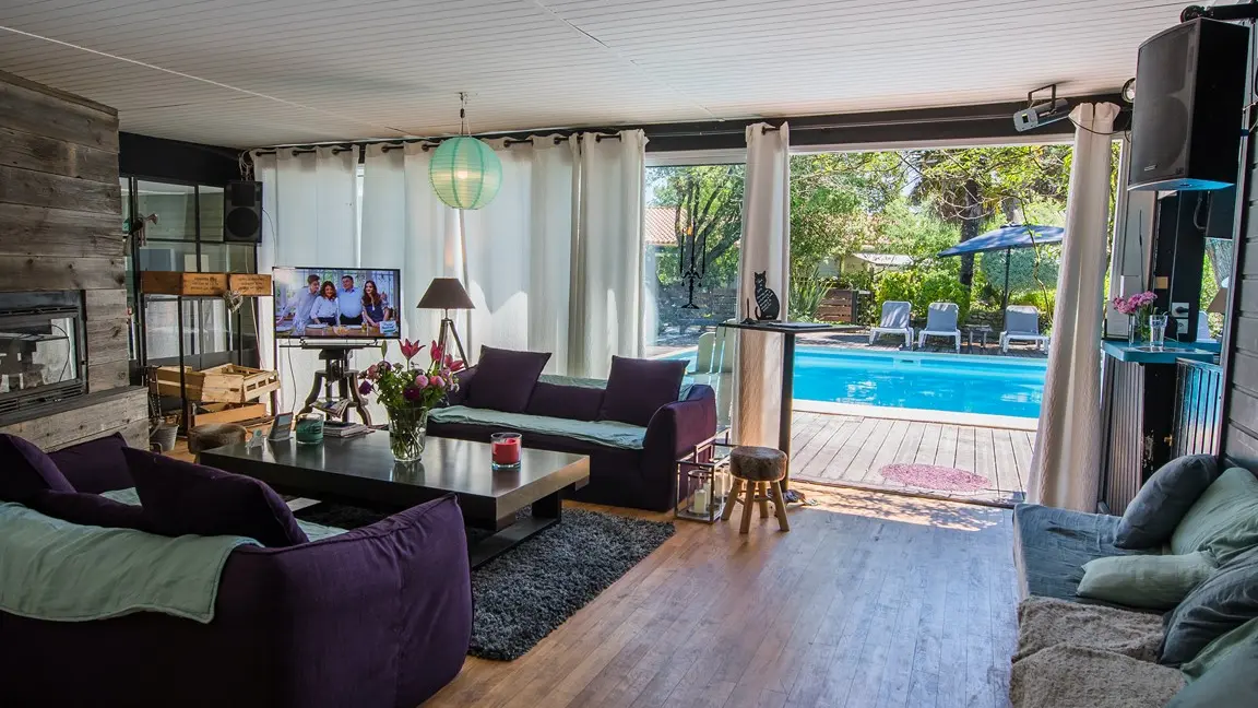 Living room with views of the terrace and pool