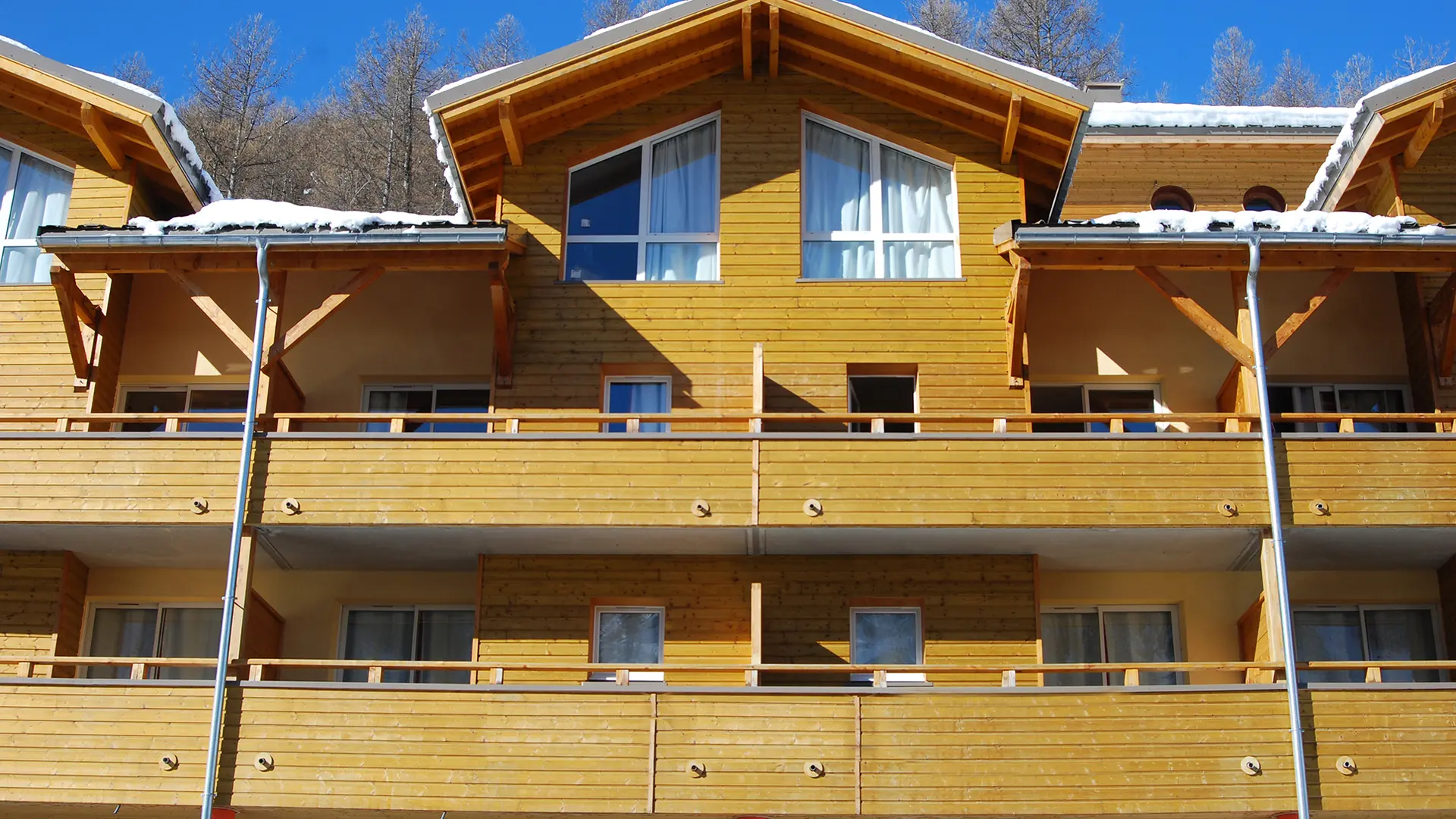 Front view of the upper floors of the residence, with terraces and windows