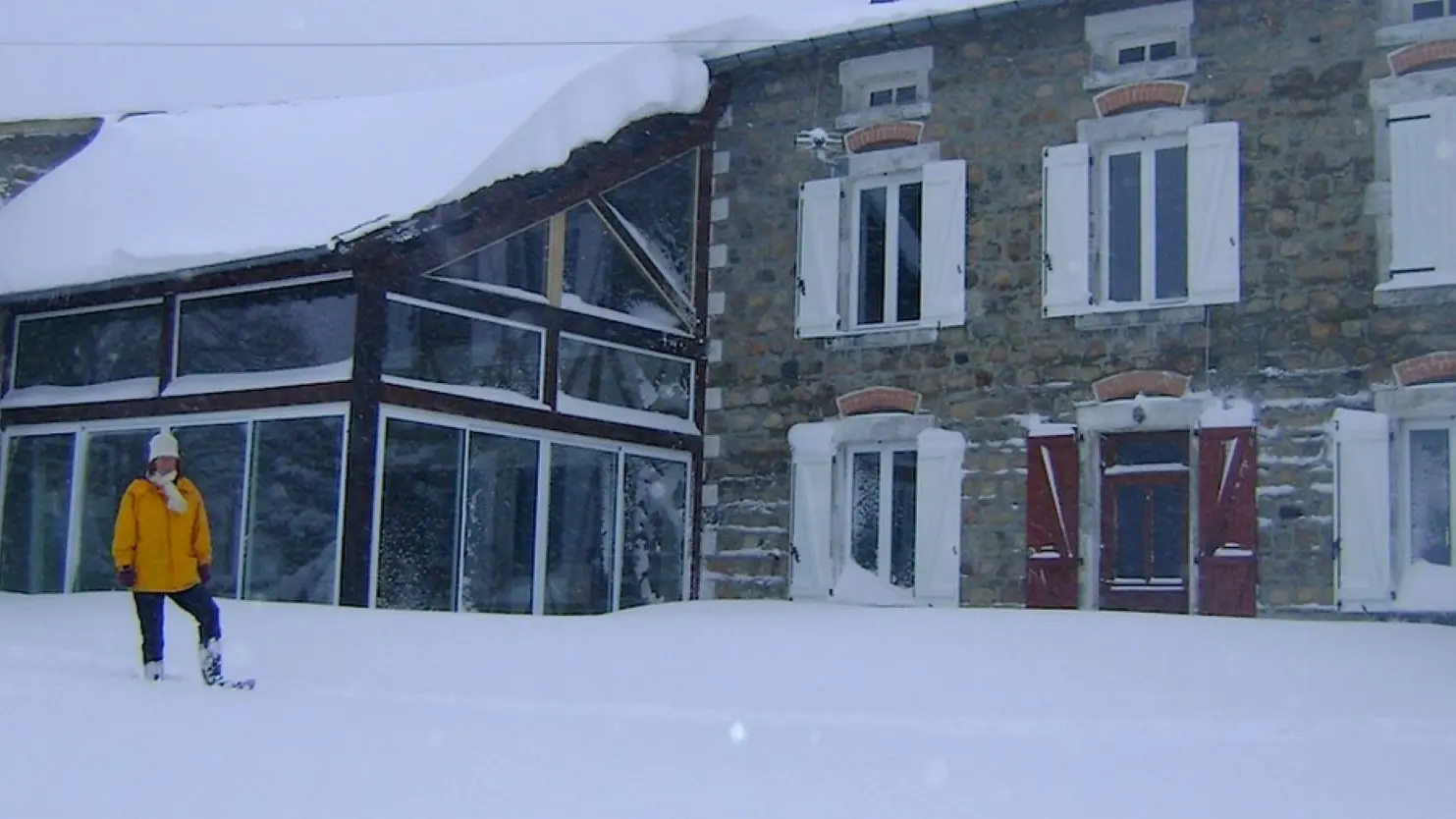Maison sous la neige