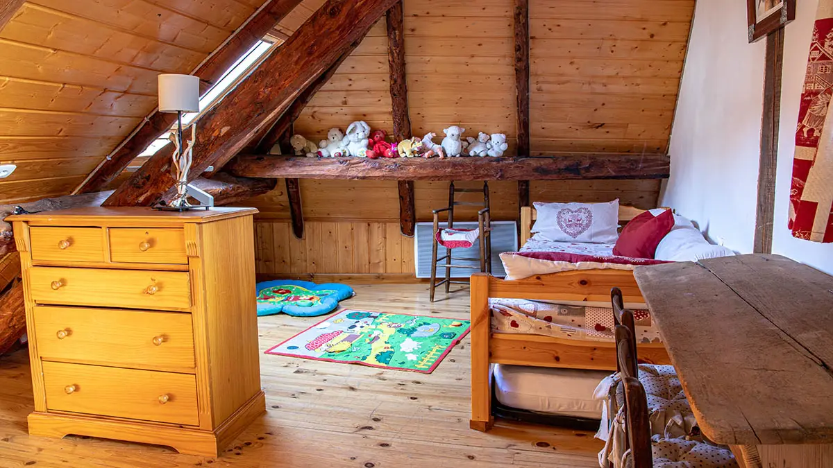 Children attic bedroom, toys, soft toys, bed and wooden furniture