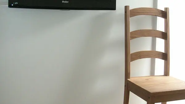 Living room area with TV, parquet flooring