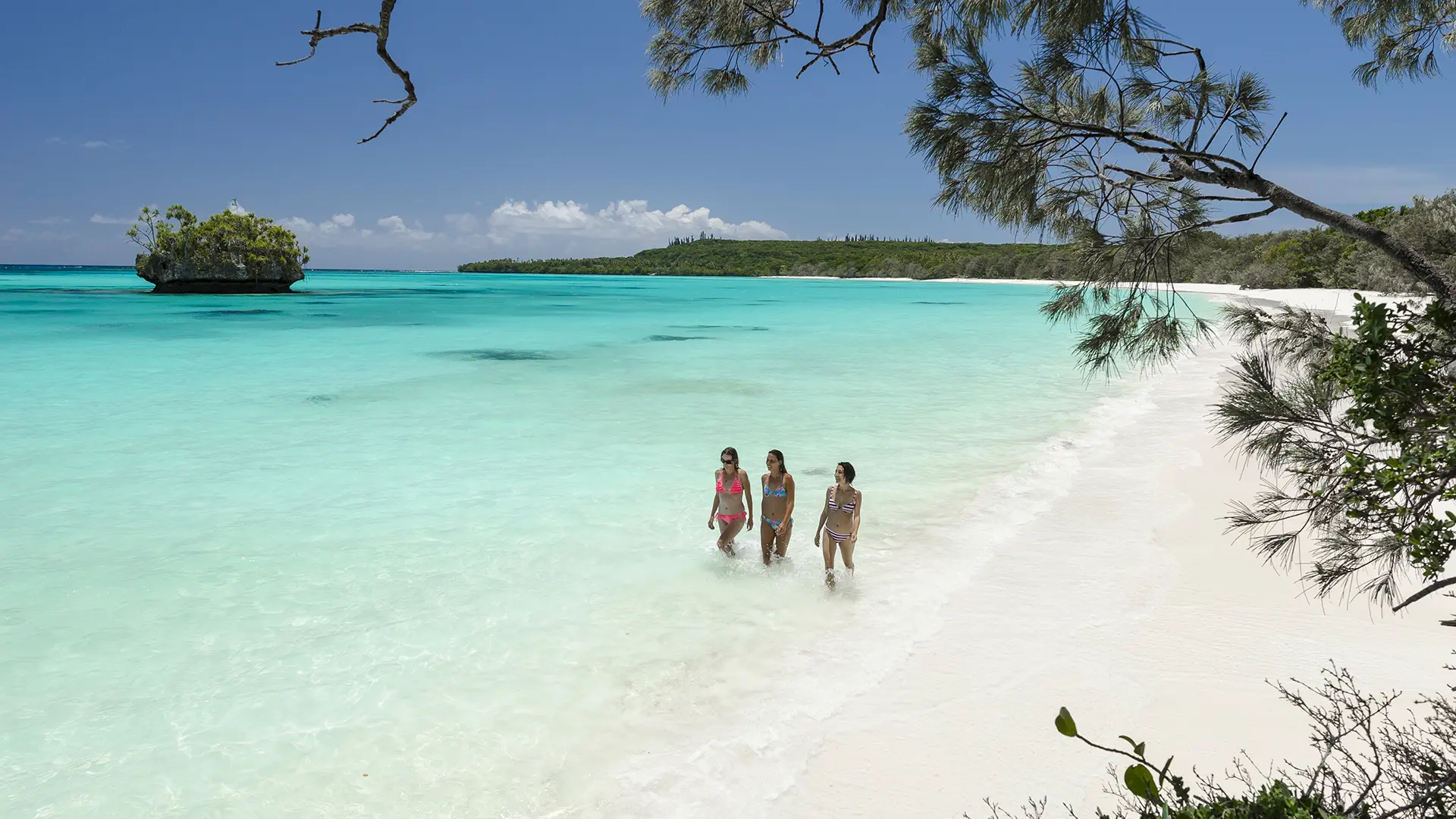 Tourists walking on the beach