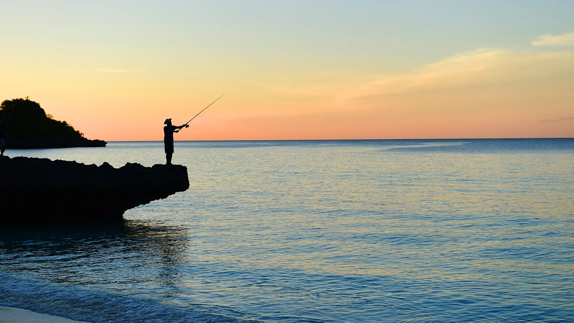 Fisherman on a rock