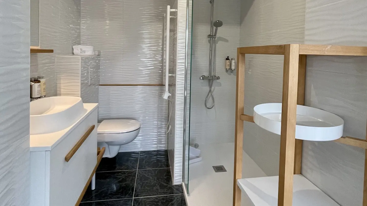 The bathroom and its walk-in shower