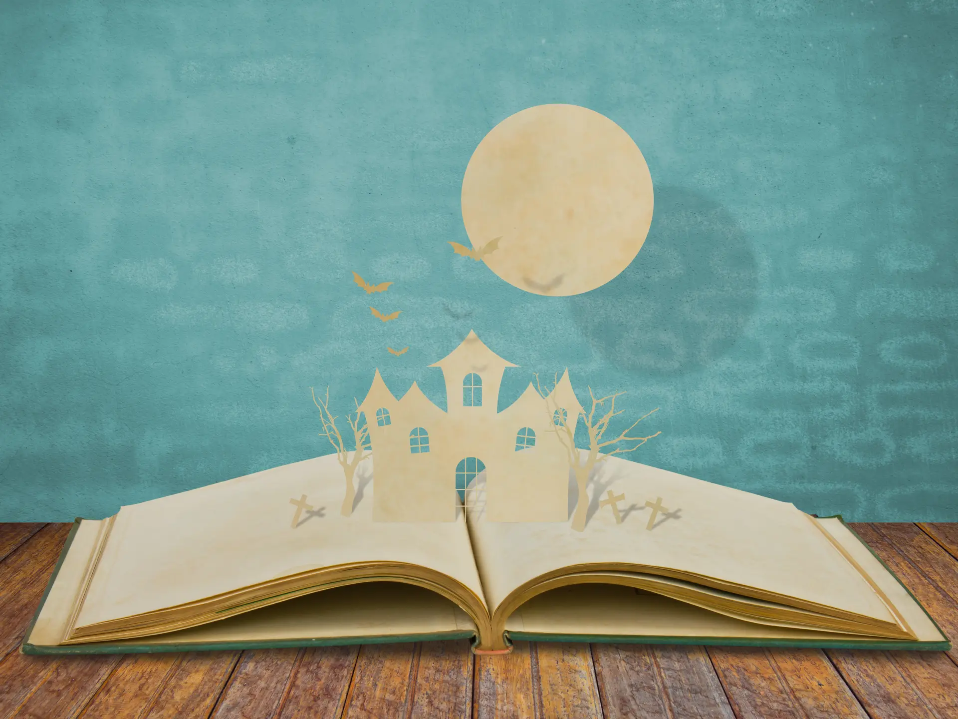 Paper cut of halloween on old book