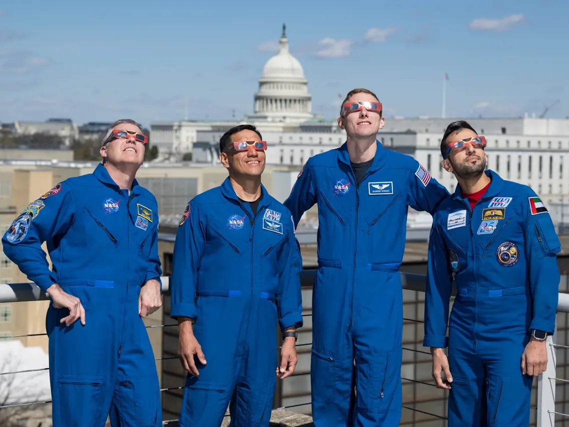 Expedition 69 Crew Wears Solar Eclipse Glasses