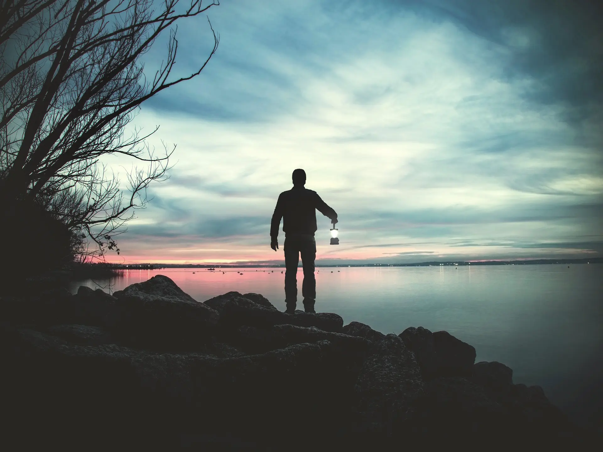 Man walking in the dark with a torch