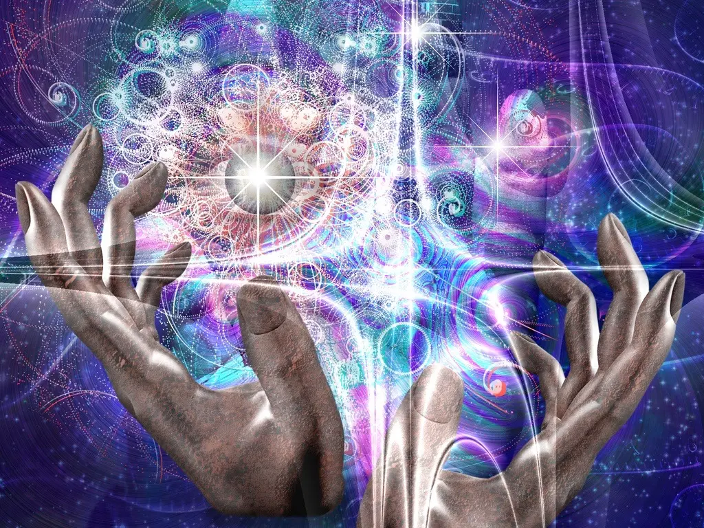 Les mains manipulent les propriétés de l’univers.